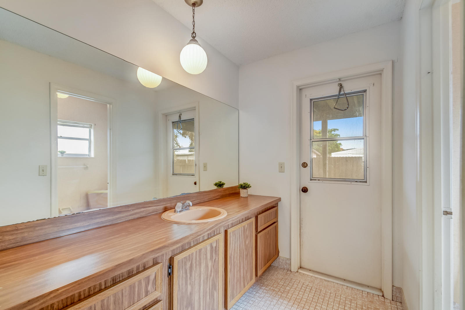 9231 Southwest 16th Road East Boca Raton, FL 33428 - Photo 21 of 32 a bathroom with a sink a vanity and a mirror