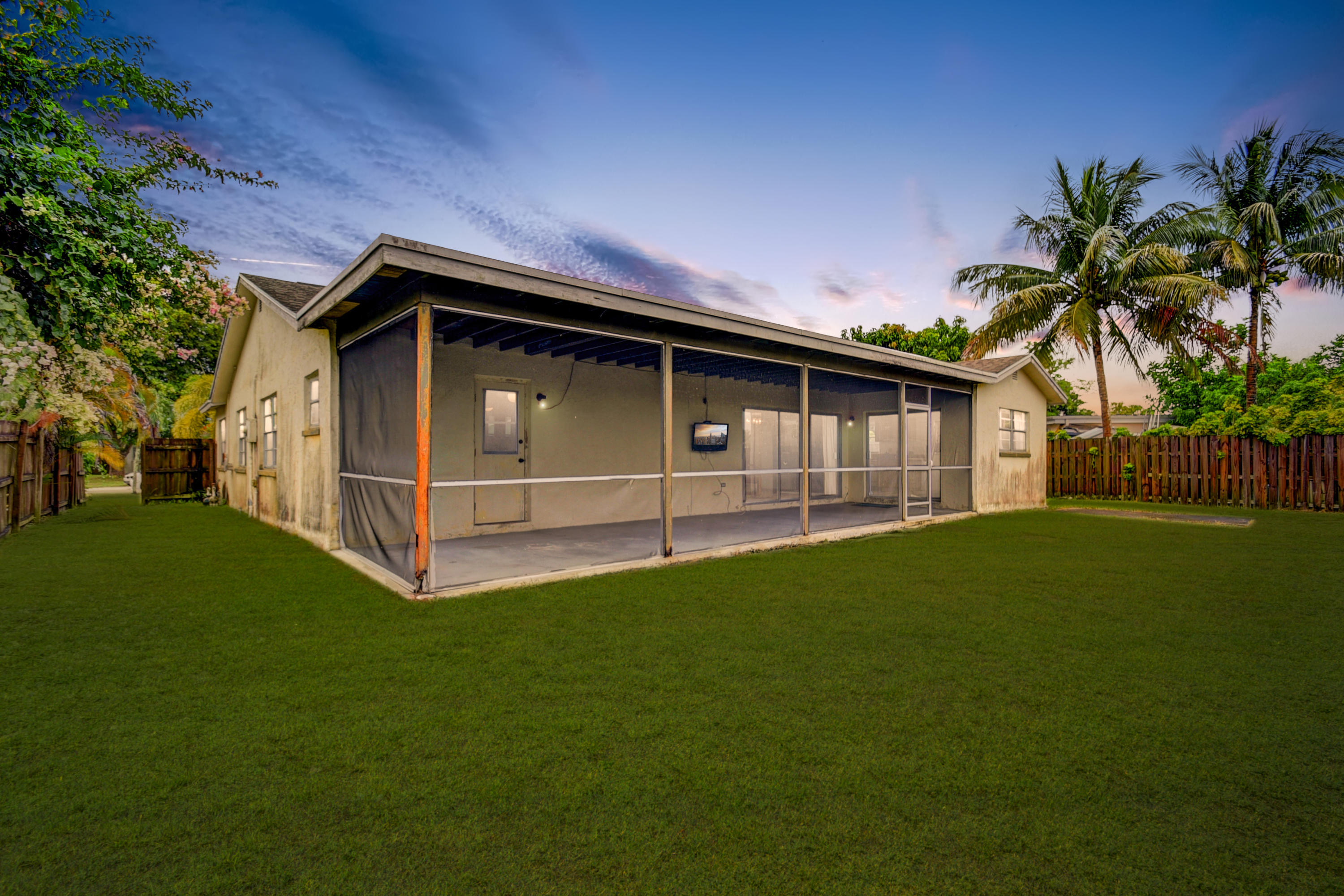 9231 Southwest 16th Road East Boca Raton, FL 33428 - Photo 30 of 32 a front view of a house with garden