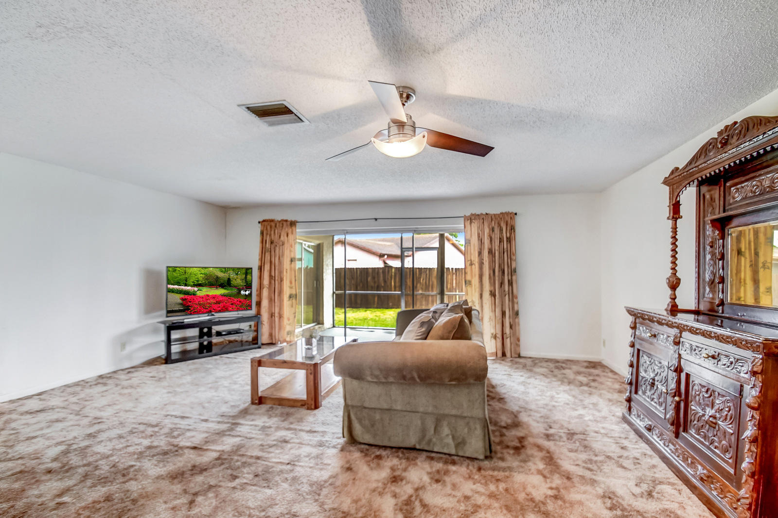 9231 Southwest 16th Road East Boca Raton, FL 33428 - Photo 8 of 32 a living room with furniture and a flat screen tv