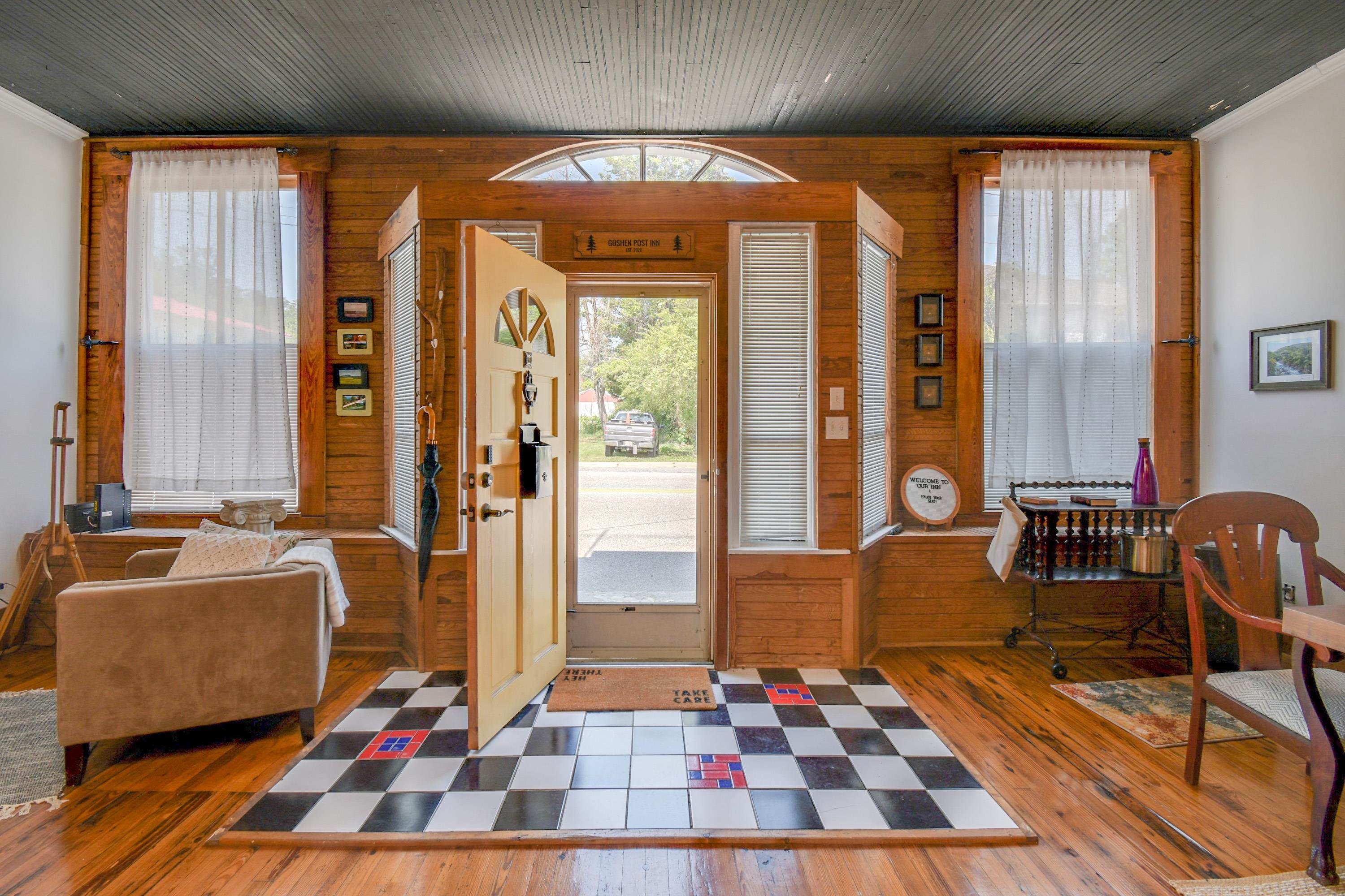 a living room with furniture and a rug
