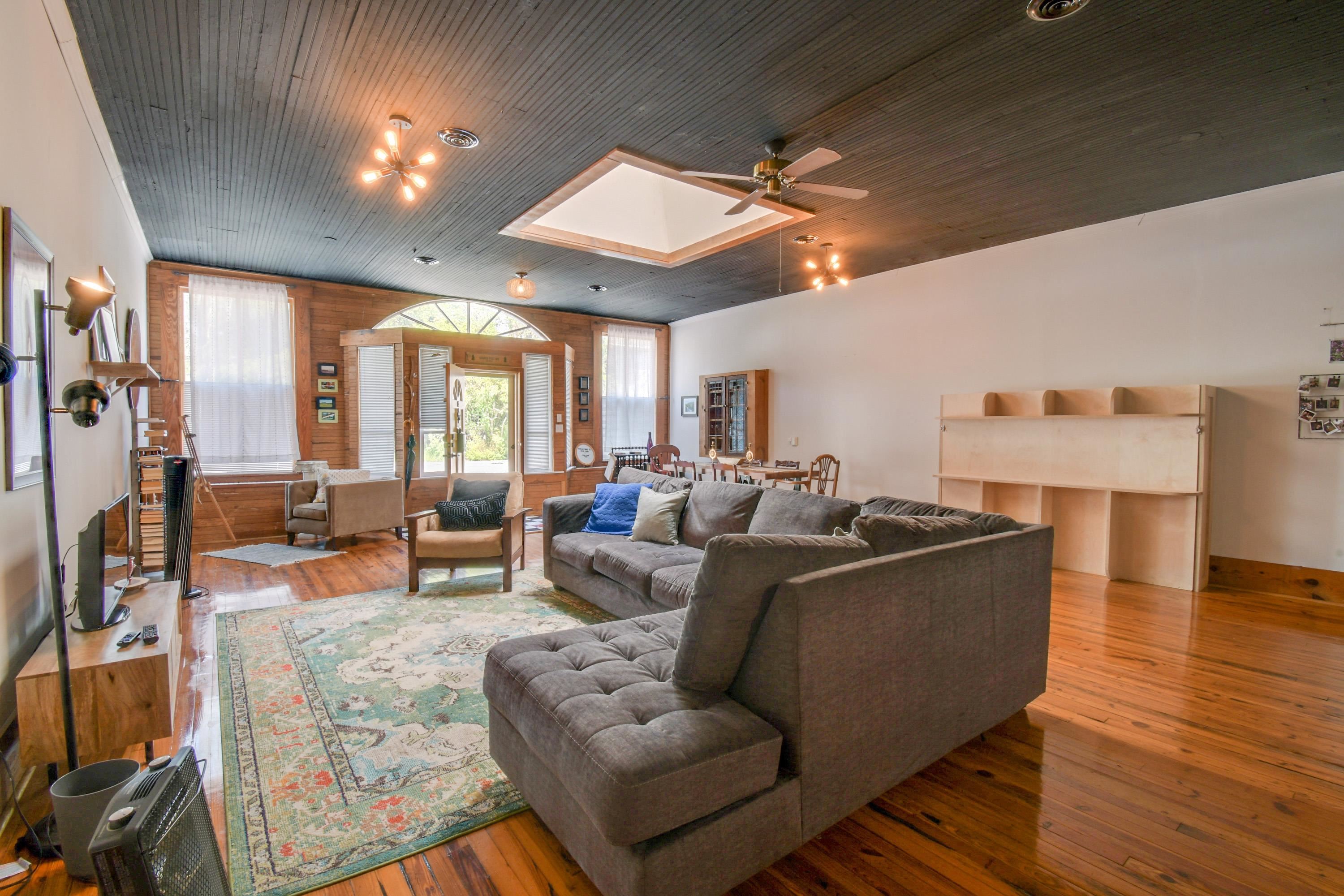 132 Main Street Goshen, VA 24439 - Photo 11 of 33 a living room with furniture and a large window
