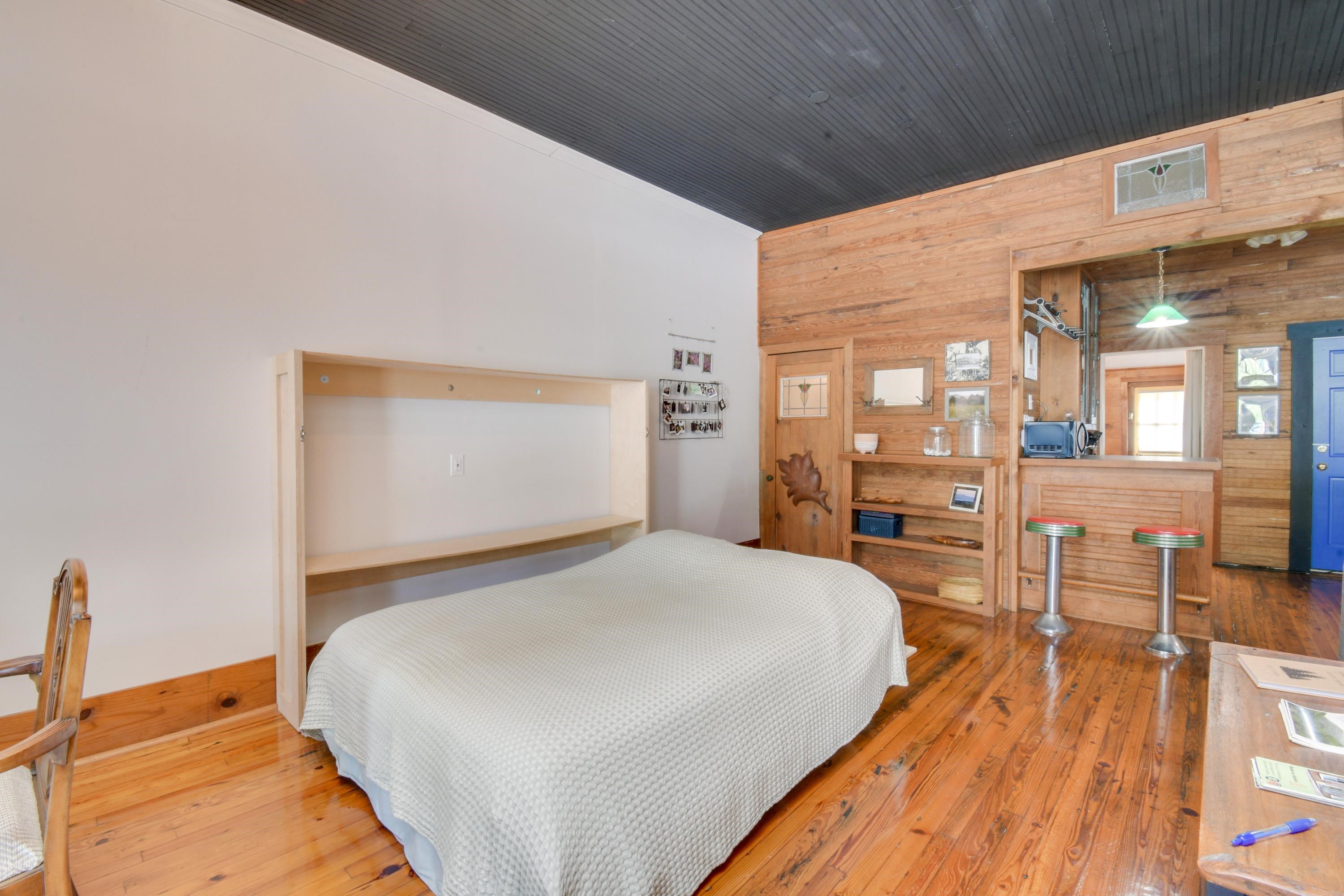 132 Main Street Goshen, VA 24439 - Photo 12 of 33 a bedroom with a bed and wooden floor
