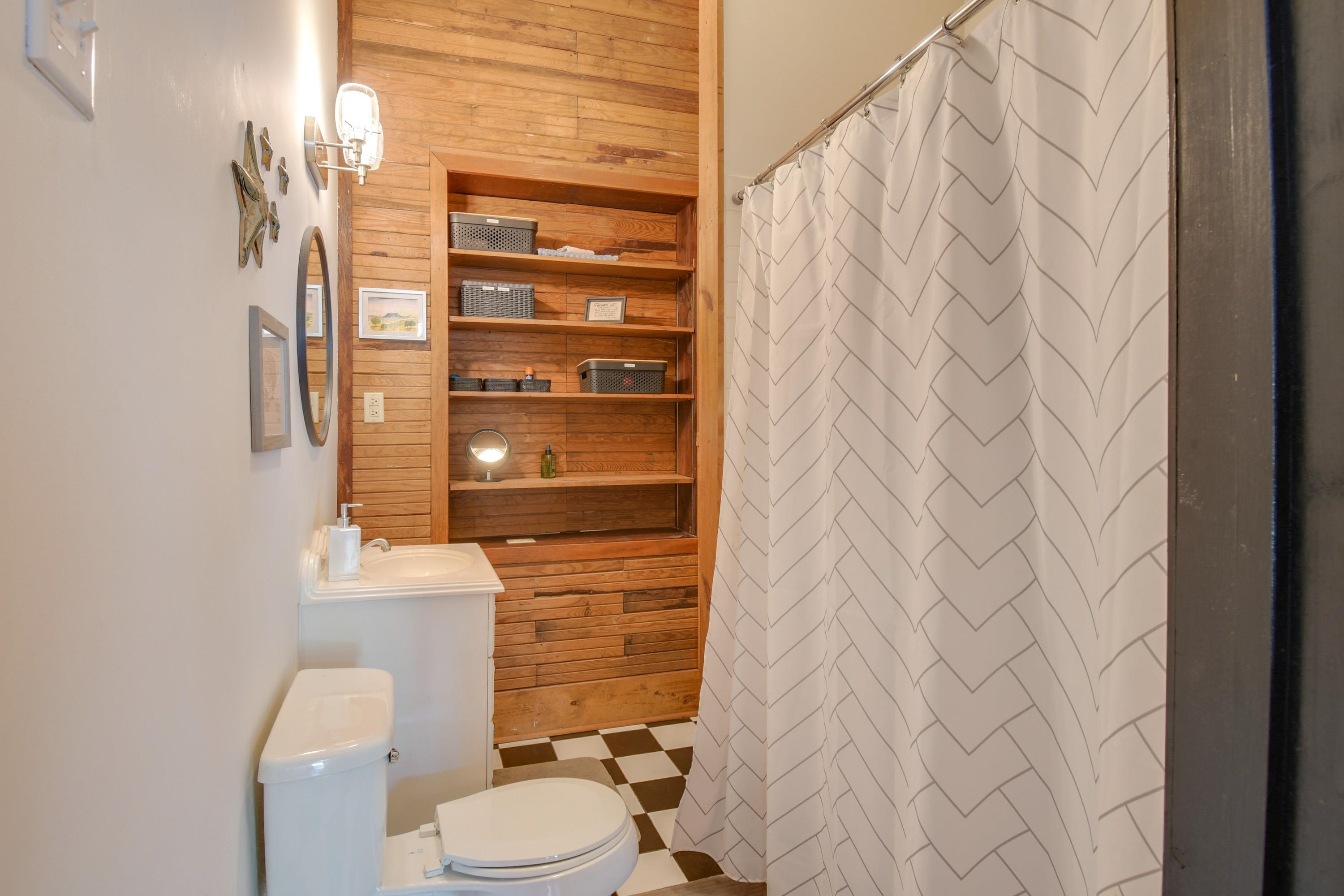 132 Main Street Goshen, VA 24439 - Photo 16 of 33 a bathroom with a toilet and a shower curtain