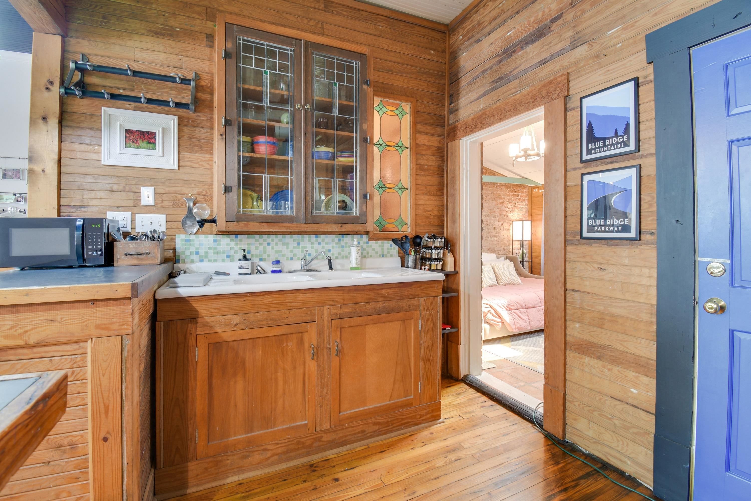 132 Main Street Goshen, VA 24439 - Photo 20 of 33 a spacious bathroom with a granite countertop sink and a mirror