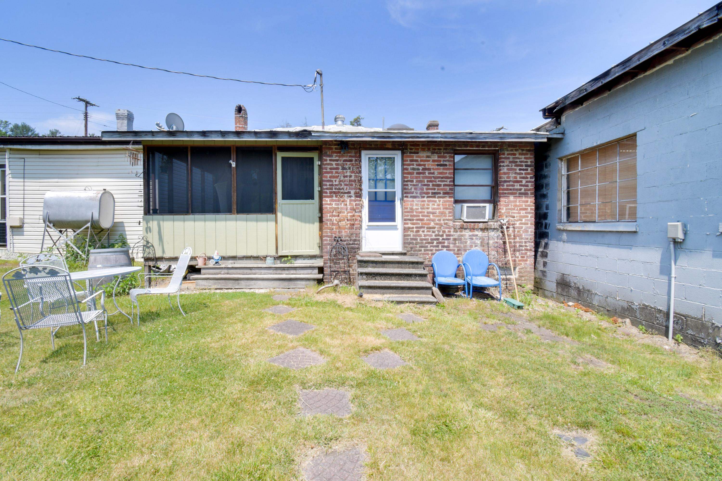 132 Main Street Goshen, VA 24439 - Photo 25 of 33 a view of a house with swimming pool and sitting area