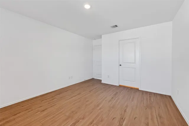 a bathroom with a sink mirror and vanity