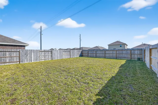 a view of a chairs and table in a balcony