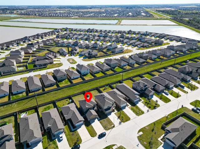 an aerial view of houses with outdoor space