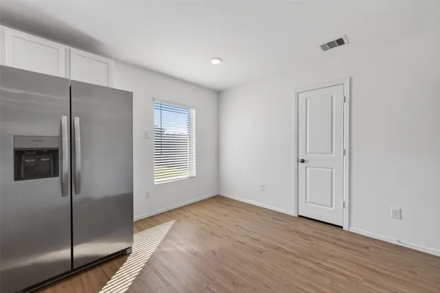 a kitchen with stainless steel appliances a refrigerator stove microwave and cabinets