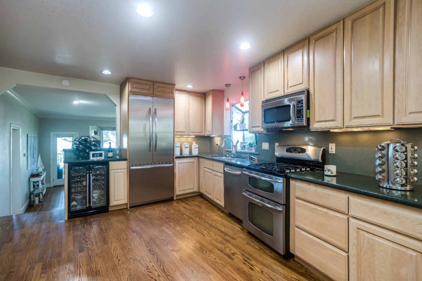 8898 Skyline Boulevard Oakland, CA 94611 - Photo 12 of 35 a large kitchen with stainless steel appliances granite countertop a stove a sink dishwasher and a refrigerator