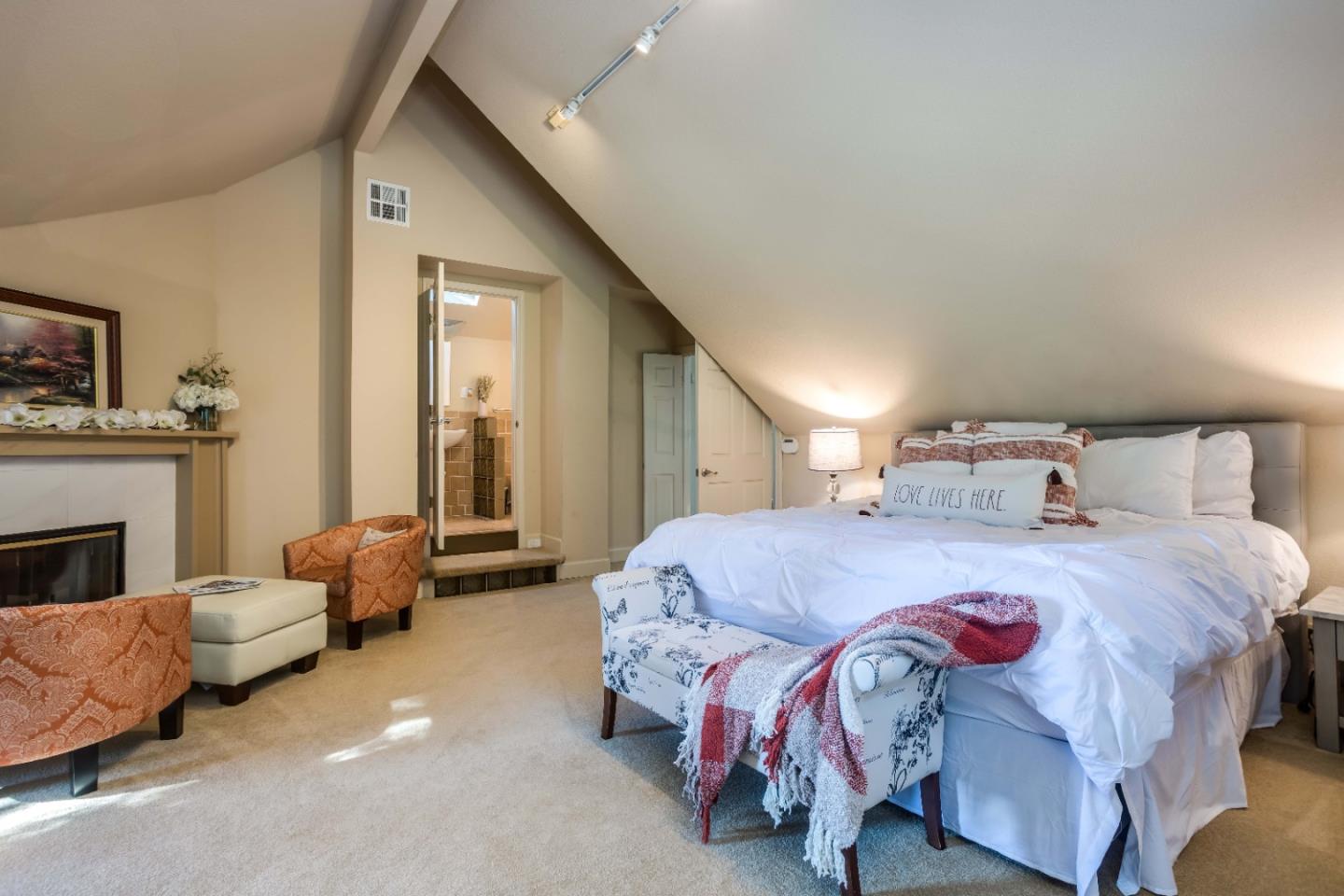 8898 Skyline Boulevard Oakland, CA 94611 - Photo 17 of 35 a bedroom with a bed and a couch