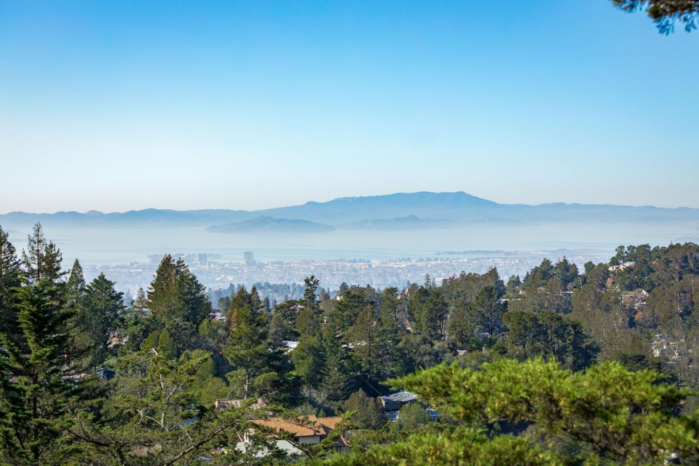 8898 Skyline Boulevard Oakland, CA 94611 - Photo 2 of 35 an aerial view of mountain with trees around