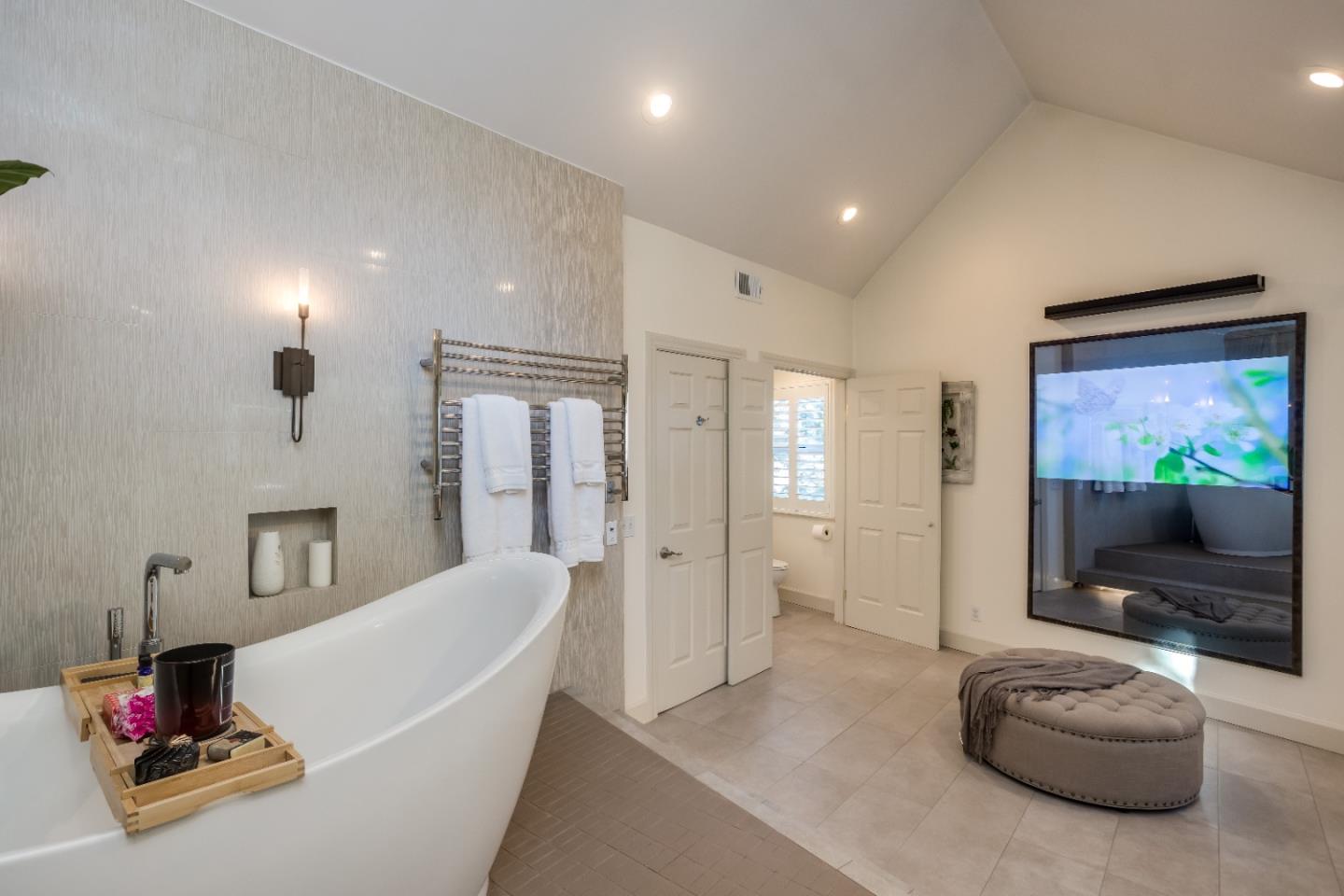 8898 Skyline Boulevard Oakland, CA 94611 - Photo 21 of 35 a living room with furniture and a flat screen tv