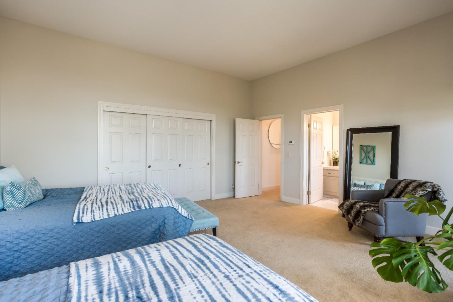 8898 Skyline Boulevard Oakland, CA 94611 - Photo 26 of 35 a bedroom with a bed and a couch