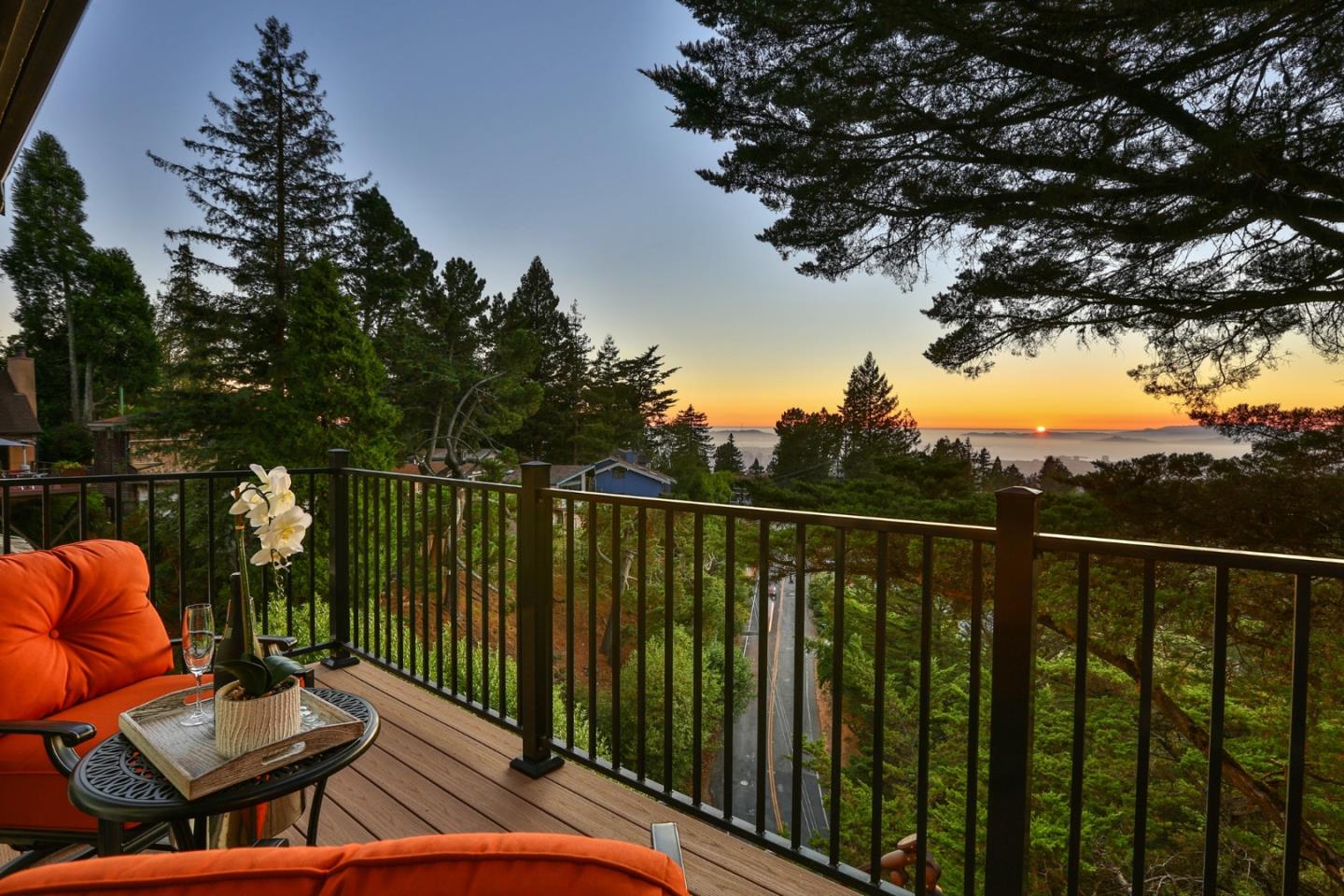 8898 Skyline Boulevard Oakland, CA 94611 - Photo 32 of 35 a balcony with wooden floor table and chairs