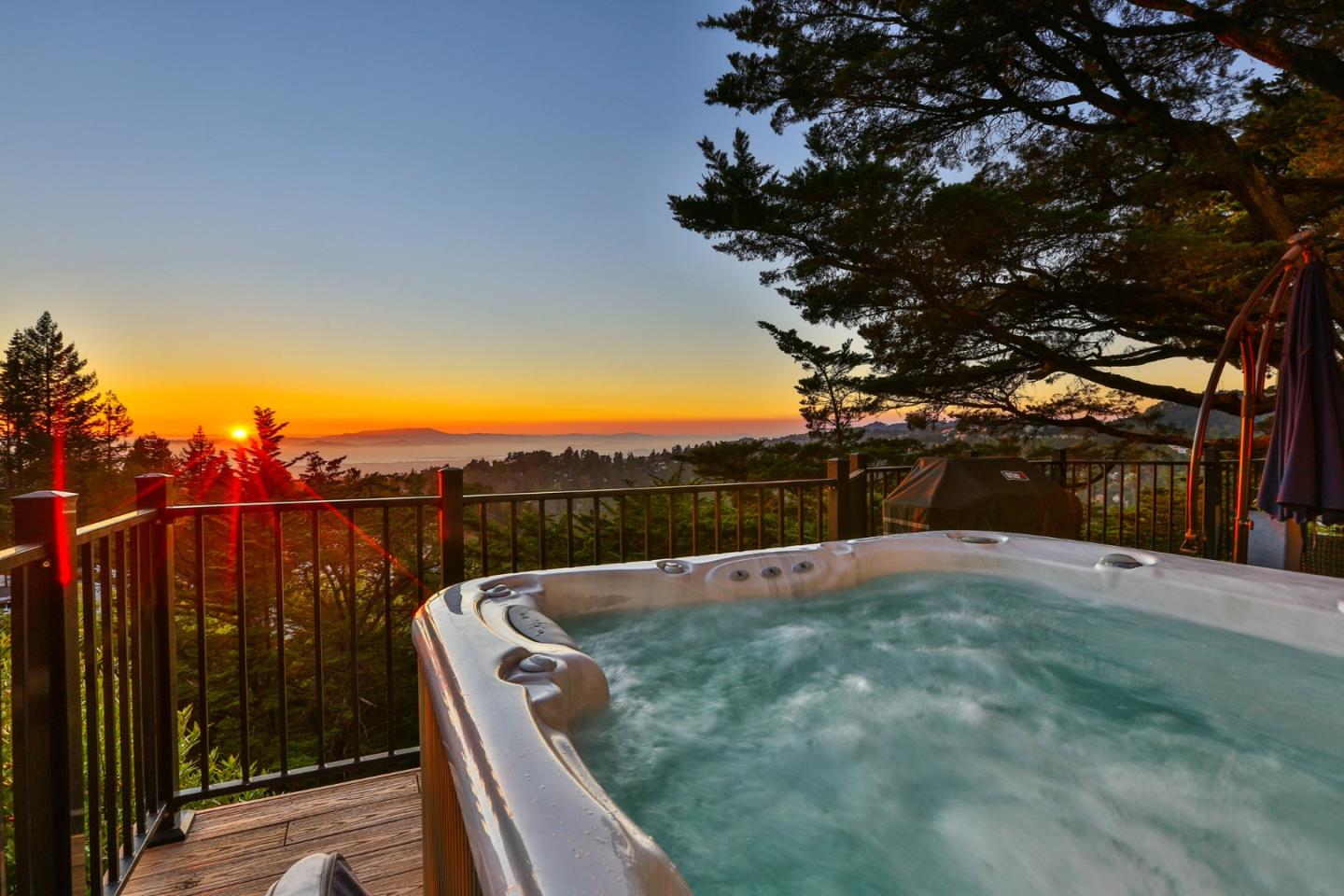 8898 Skyline Boulevard Oakland, CA 94611 - Photo 33 of 35 a view of balcony with wooden floor and trees