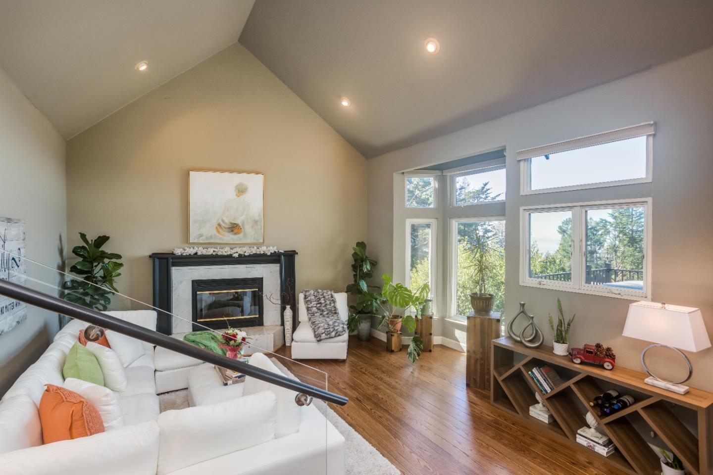 8898 Skyline Boulevard Oakland, CA 94611 - Photo 5 of 35 a living room with furniture and a fireplace
