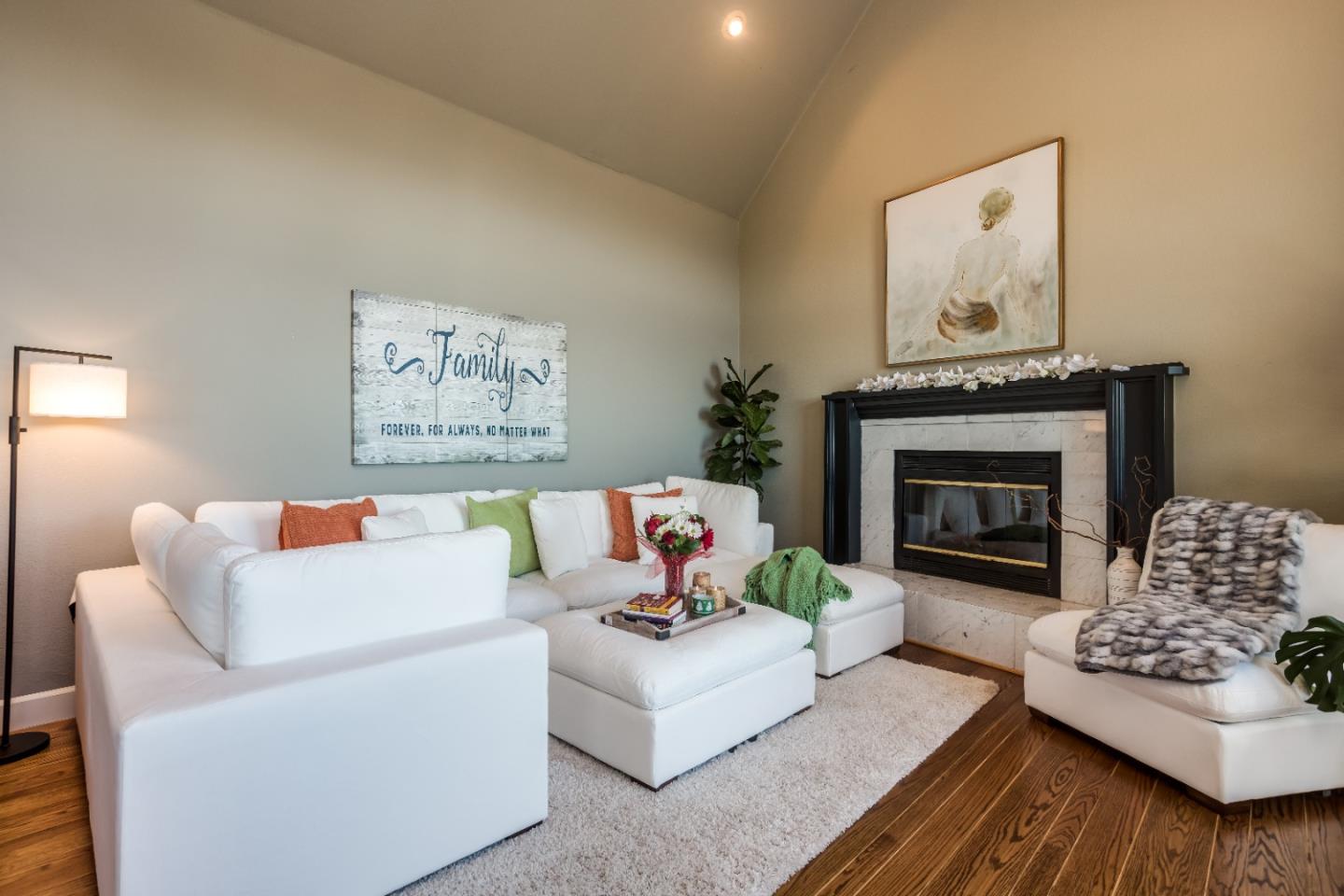 8898 Skyline Boulevard Oakland, CA 94611 - Photo 7 of 35 a living room with furniture and a fireplace