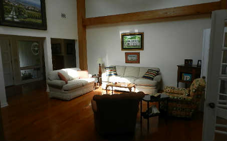 20 Sea Marsh Road Fernandina Beach, FL 32034 - Photo 12 of 12 a living room with furniture and a flat screen tv