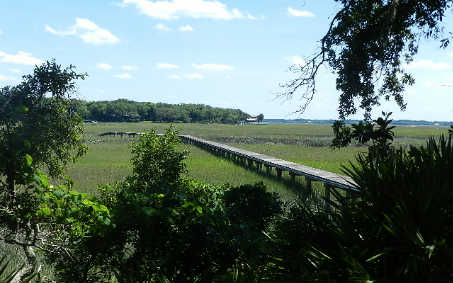 20 Sea Marsh Road Fernandina Beach, FL 32034 - Photo 2 of 12 a view of a lake with a mountain and a yard