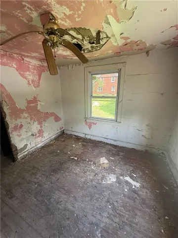 a view of a room with rack and wooden floor
