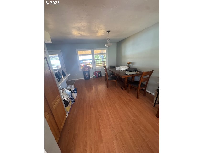 911 Division La Grande, OR 97850 - Photo 11 of 39 a living room with furniture and a wooden floor