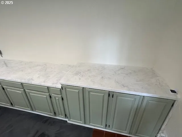 a kitchen with a sink and a stove top oven