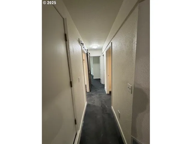 a bathroom with a shower and toilet