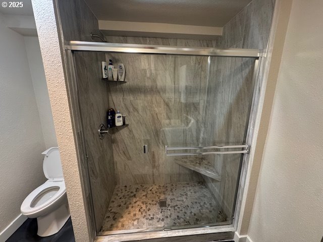 911 Division La Grande, OR 97850 - Photo 21 of 39 a bathroom with a shower and toilet