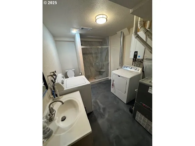 a bedroom with bed and walk in closet