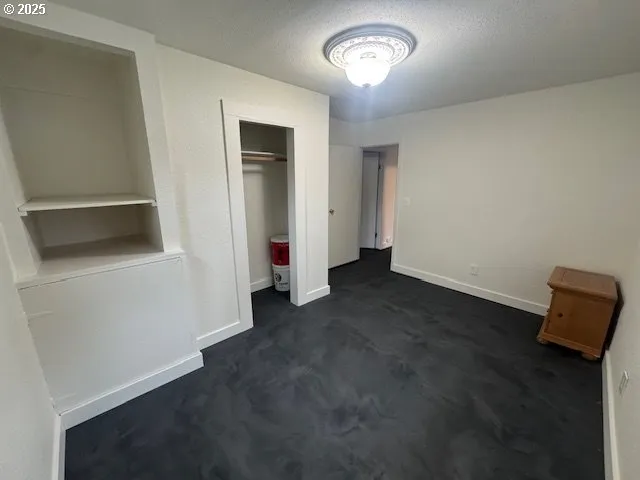 a view of a room with rack and window