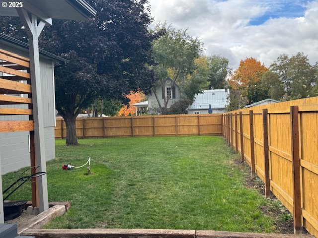911 Division La Grande, OR 97850 - Photo 30 of 39 a view of a backyard with wooden fence