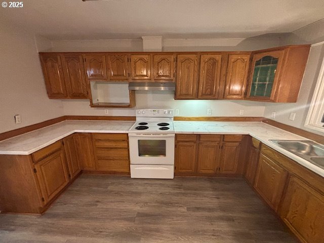911 Division La Grande, OR 97850 - Photo 4 of 39 a kitchen with stainless steel appliances a stove sink and cabinets