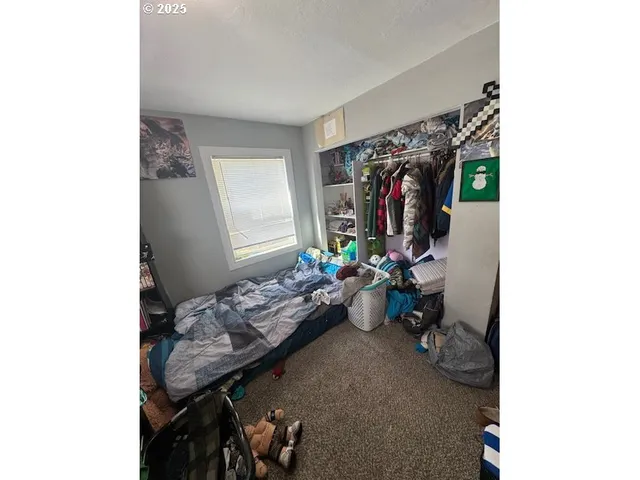 a view of livingroom with furniture and closet