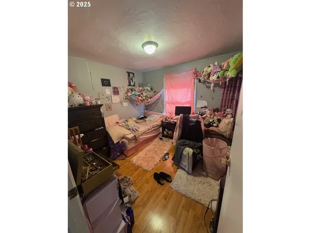 a bed room with furniture and a window