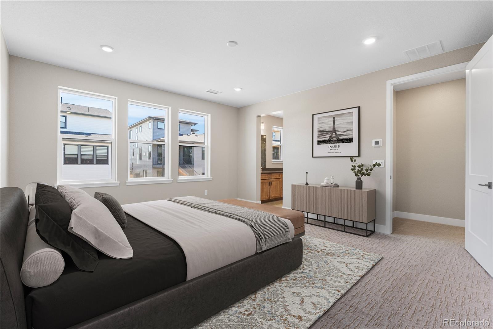 11110 Encantado Trail Lone Tree, CO 80134 - Photo 21 of 30 a bedroom with a bed and wooden floor