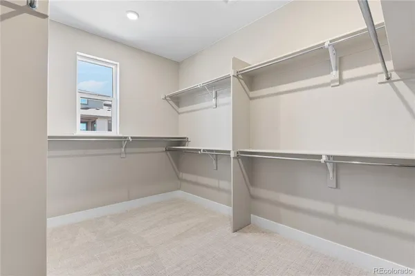 a view of an empty walk in closet