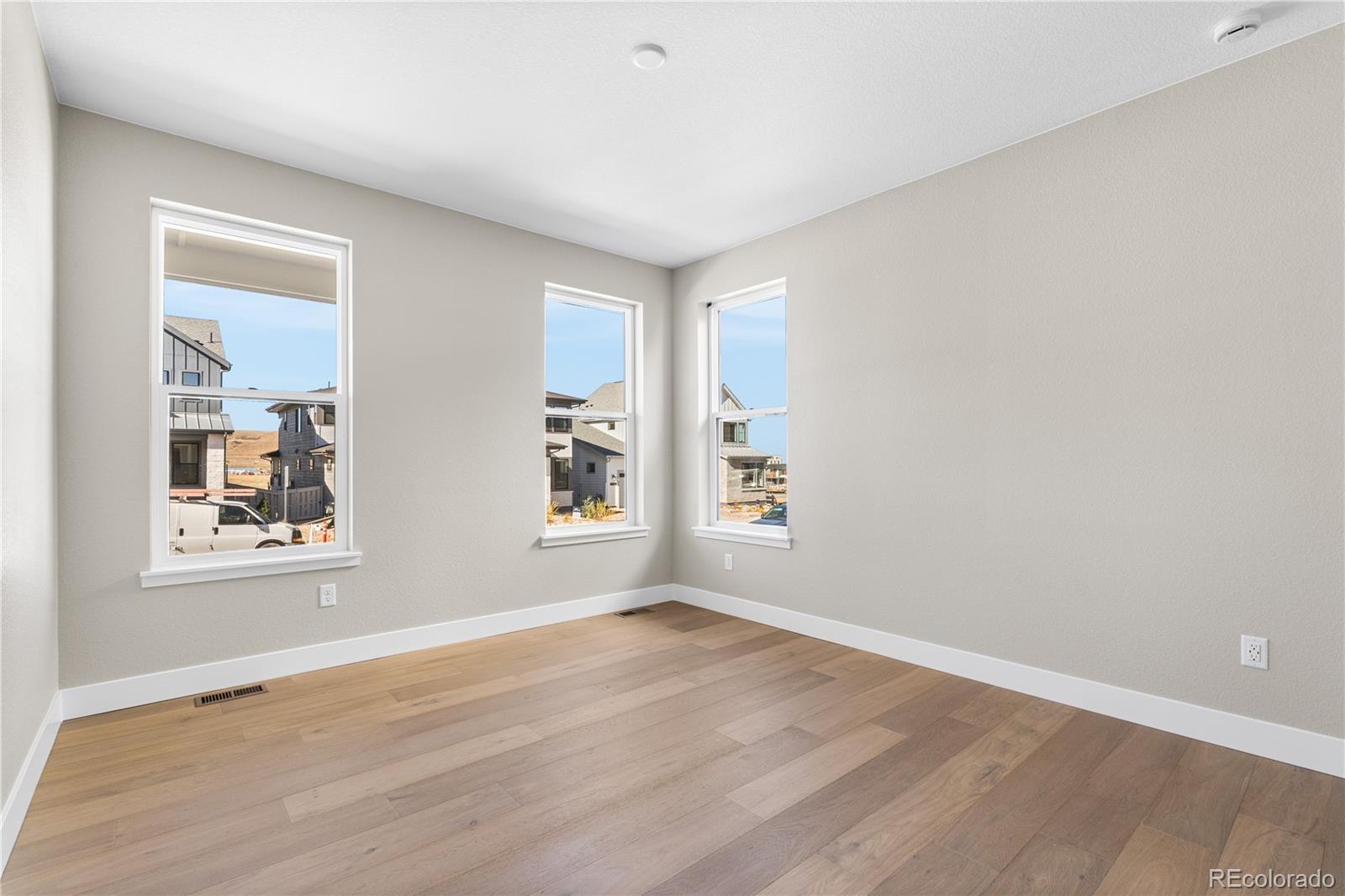 11110 Encantado Trail Lone Tree, CO 80134 - Photo 3 of 30 an empty room with windows and closet