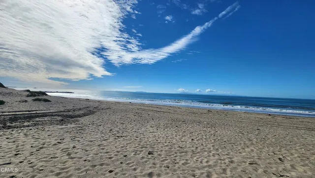 a view of a backyard of the house