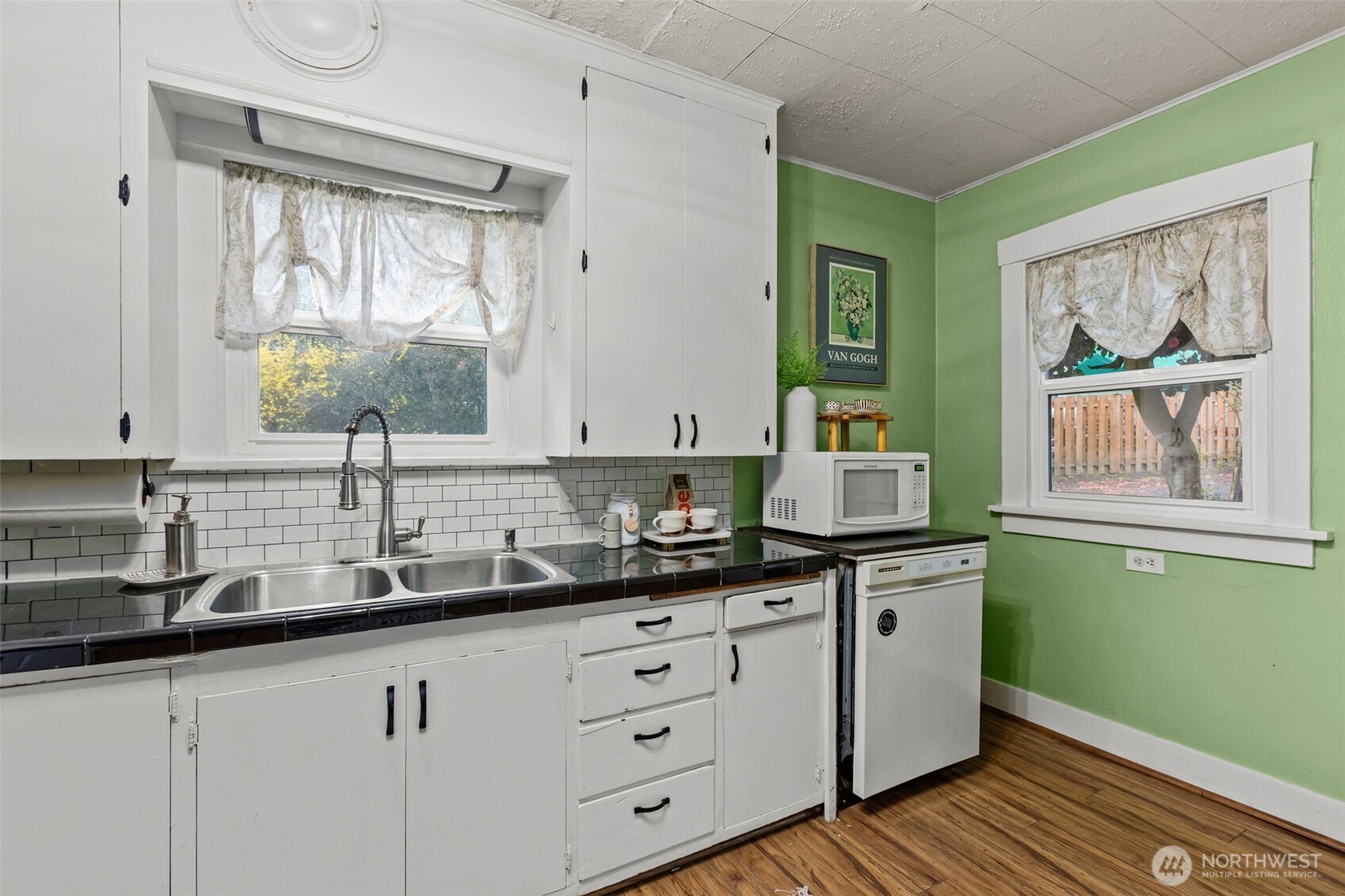 7030 Beverly Boulevard Everett, WA 98203 - Photo 12 of 37 a kitchen with cabinets a window and a sink