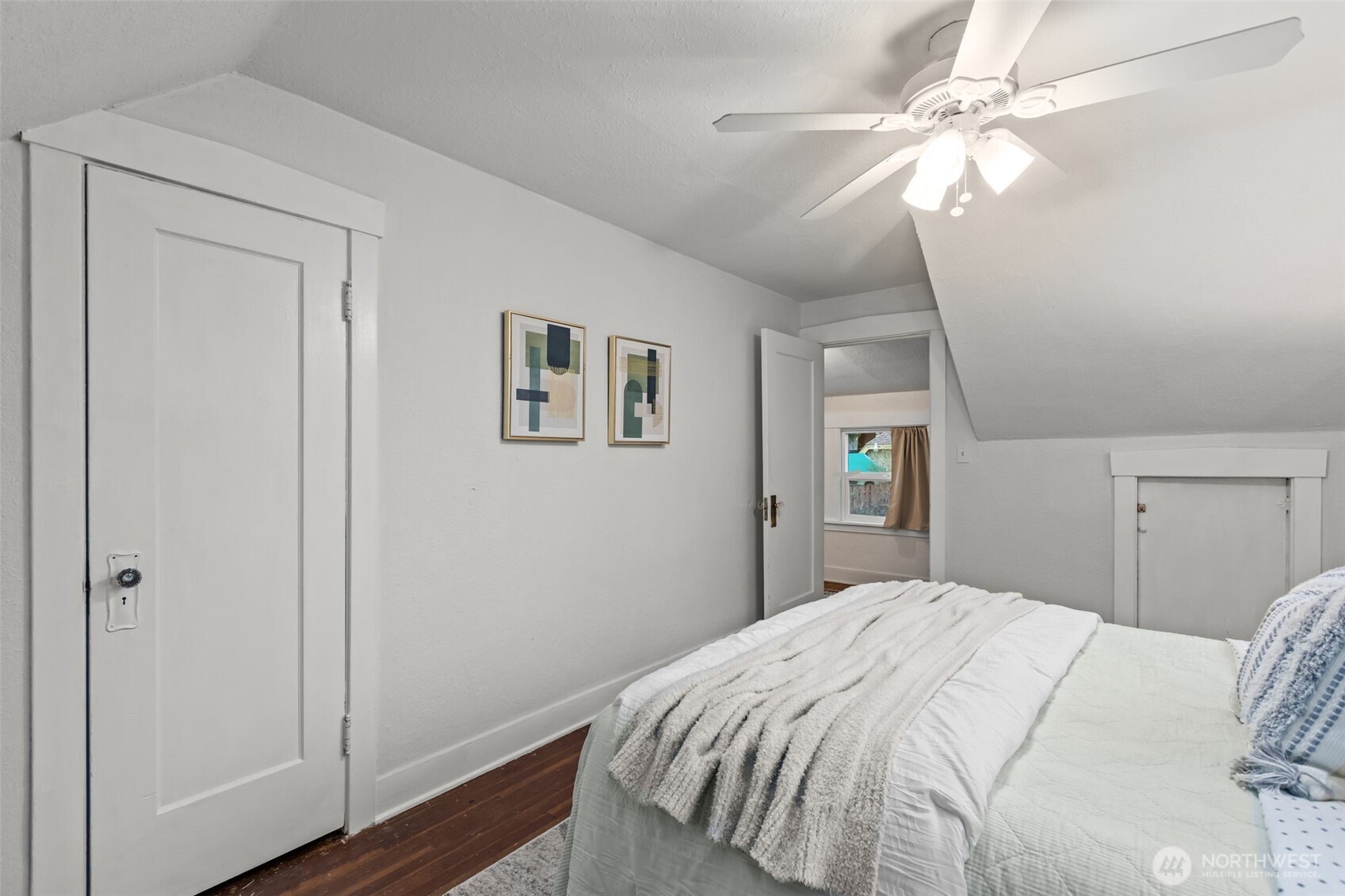 7030 Beverly Boulevard Everett, WA 98203 - Photo 17 of 37 a bedroom with a large bed and a chandelier