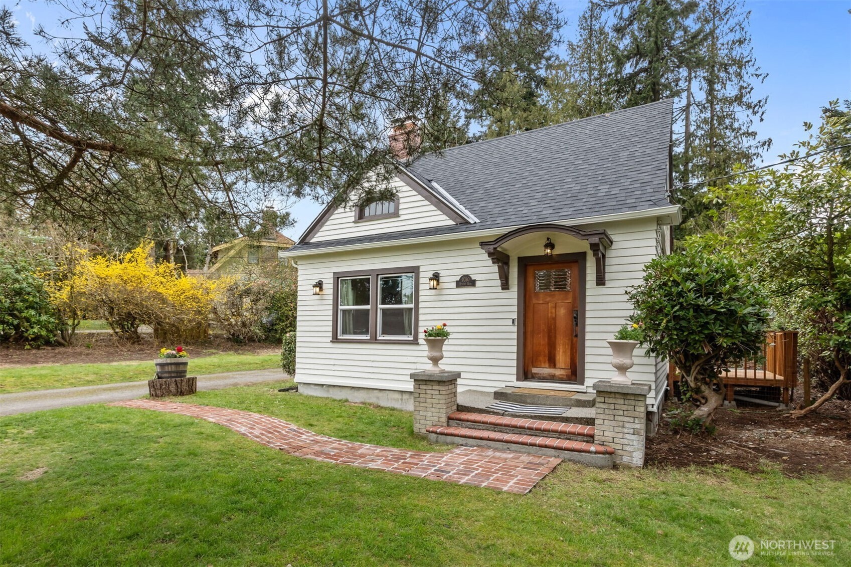 7030 Beverly Boulevard Everett, WA 98203 - Photo 2 of 37 a front view of a house with a yard