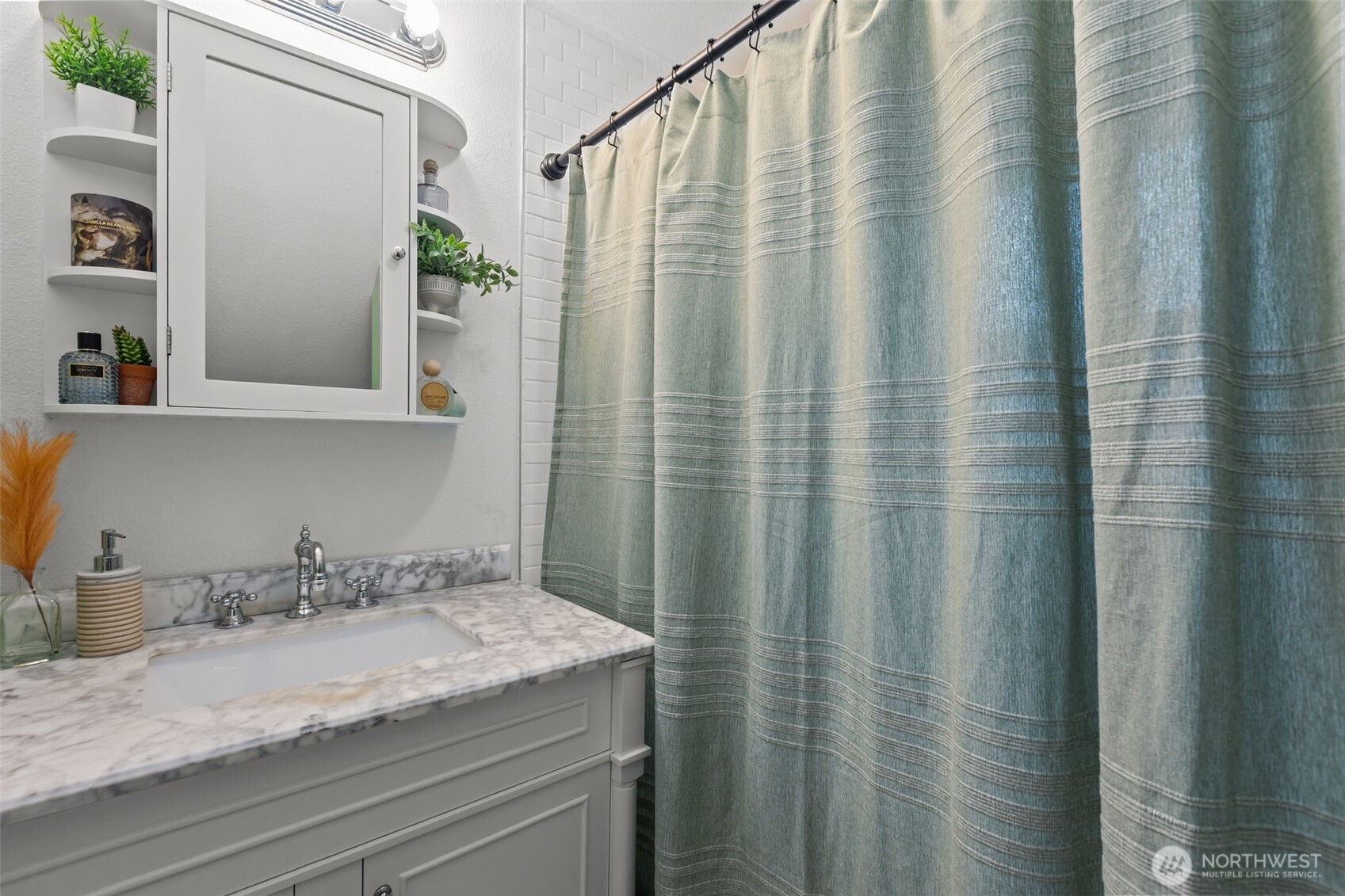 7030 Beverly Boulevard Everett, WA 98203 - Photo 21 of 37 a bathroom with a granite countertop sink and a mirror