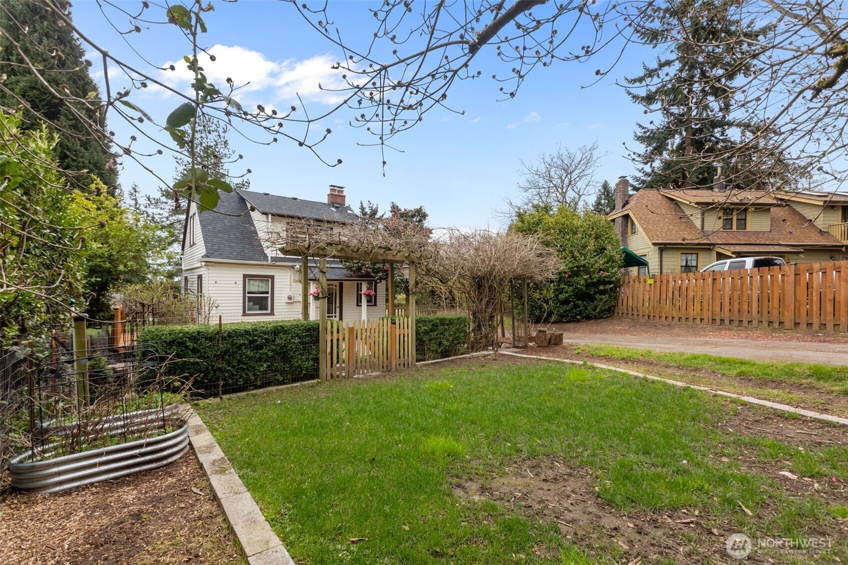 7030 Beverly Boulevard Everett, WA 98203 - Photo 35 of 37 a front view of a house with garden