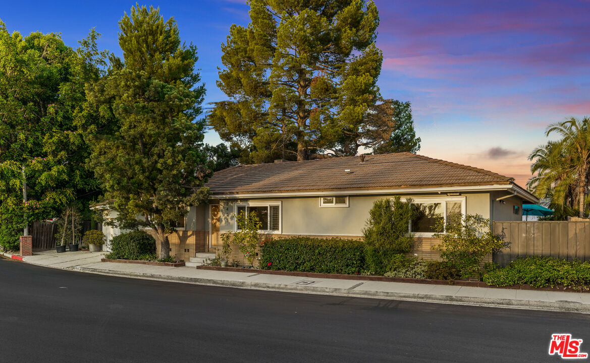 2438 Roscomare Road Los Angeles, CA 90077 - Photo 3 of 17 front view of a house with a yard