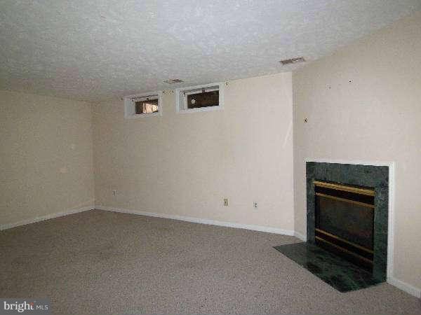 525 Ridgefield Avenue Stephens City, VA 22655 - Photo 13 of 26 a view of empty room with a fireplace