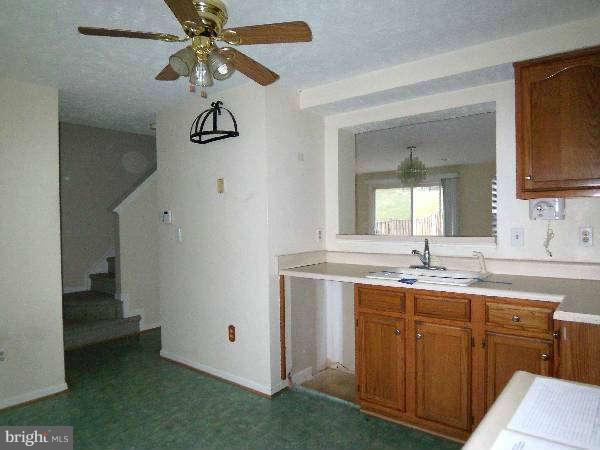 525 Ridgefield Avenue Stephens City, VA 22655 - Photo 19 of 26 a bathroom with a granite countertop sink a toilet and mirror