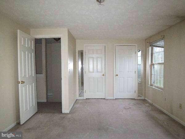 525 Ridgefield Avenue Stephens City, VA 22655 - Photo 25 of 26 an empty room with windows and closet