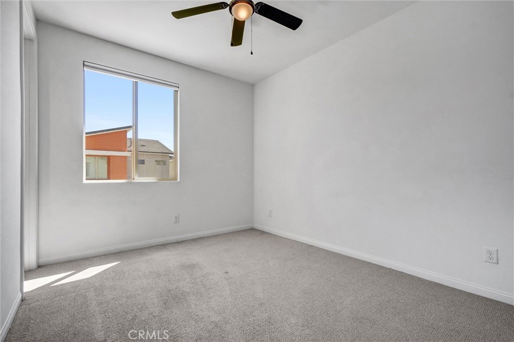 653 Longhorn Way Rancho Mission Viejo, CA 92694 - Photo 18 of 30 an empty room with a window and a ceiling fan