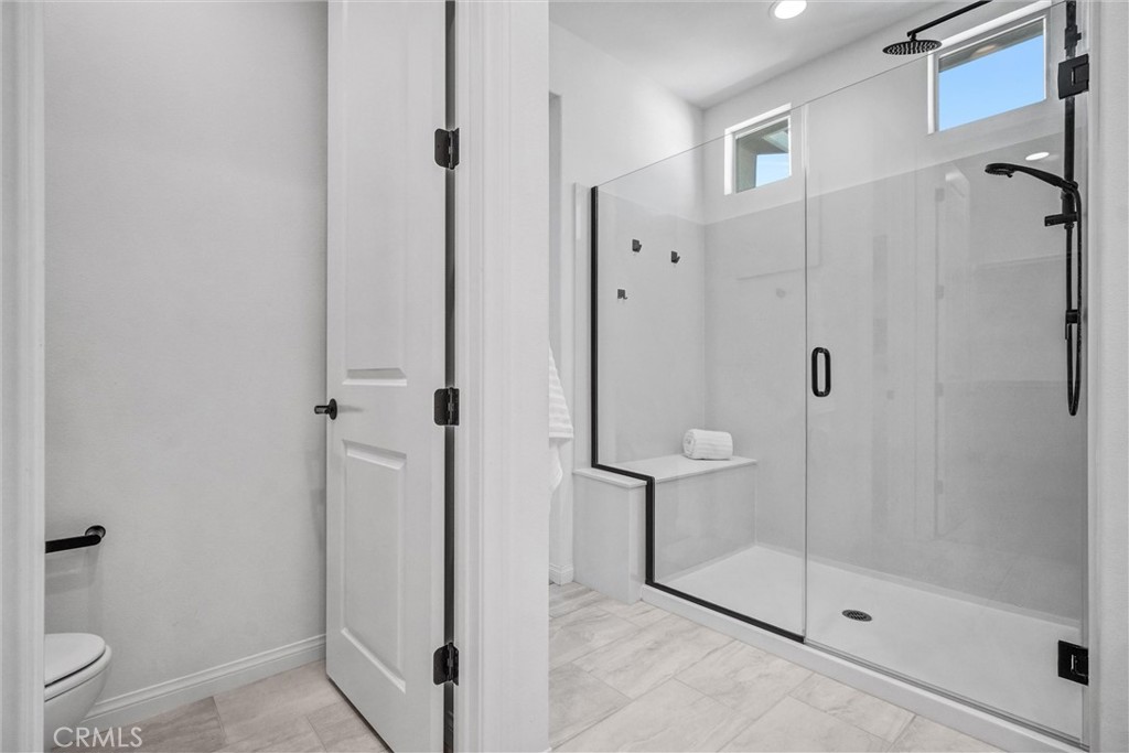 653 Longhorn Way Rancho Mission Viejo, CA 92694 - Photo 25 of 30 a bathroom with a shower and toilet